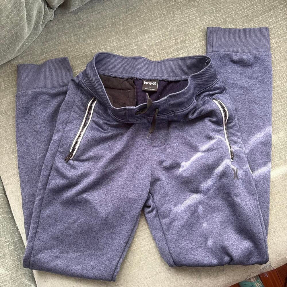 Blue Hurley Nike Dri-Fit sweatpants with zipper pockets